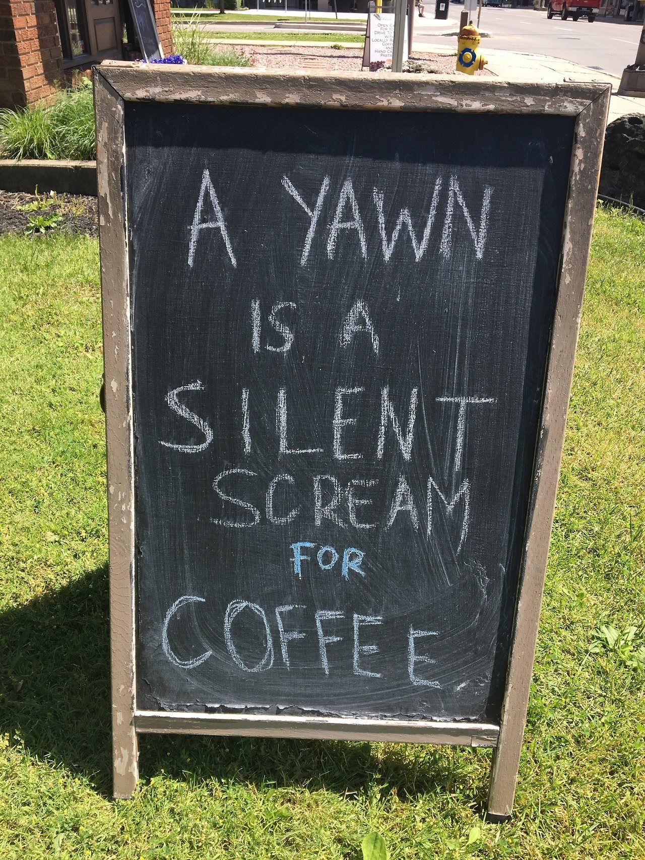 Yawn is a silent scream for coffee sign